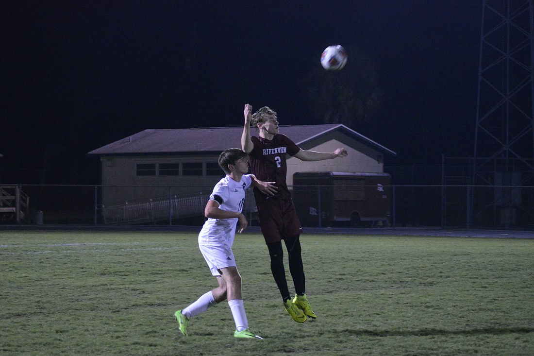 Riverview sophomore defender Joey St. Onge out-leaps a Venice player for a header.