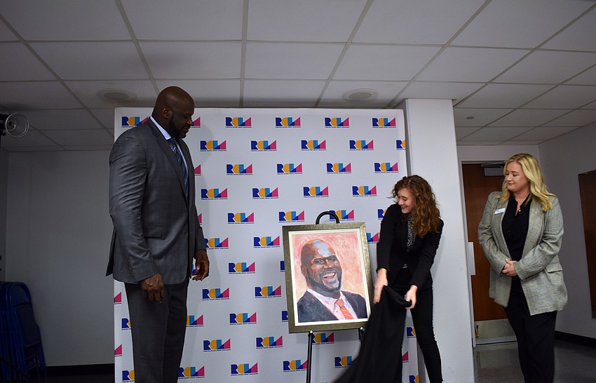 Ringling College of Art and Design junior Jamie Green showed Shaquille O'Neal her oil painting of him Jan. 16.