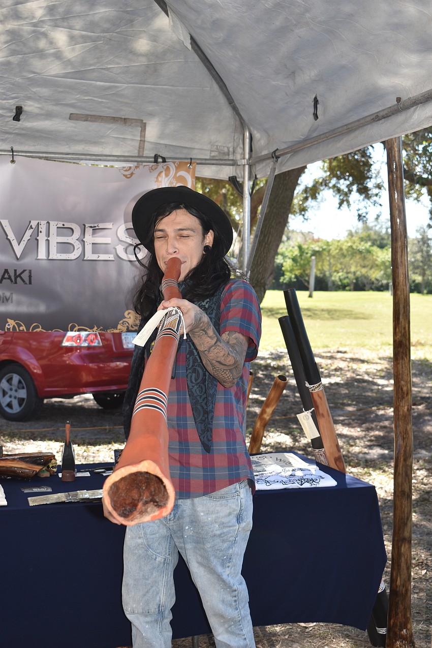 Anthony Aleman, from West Wind Vibes, plays the didgeridoo.