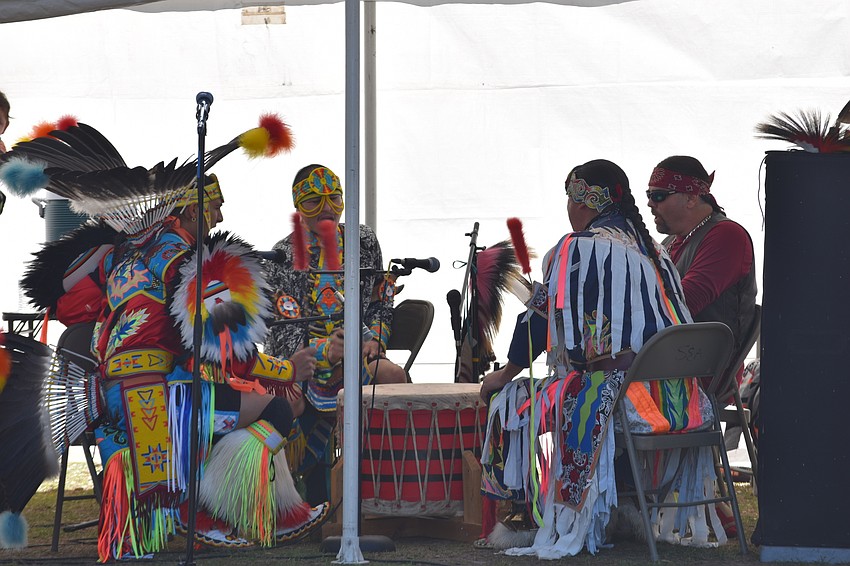 The Drum Group plays music for the dancers performing for the audience.