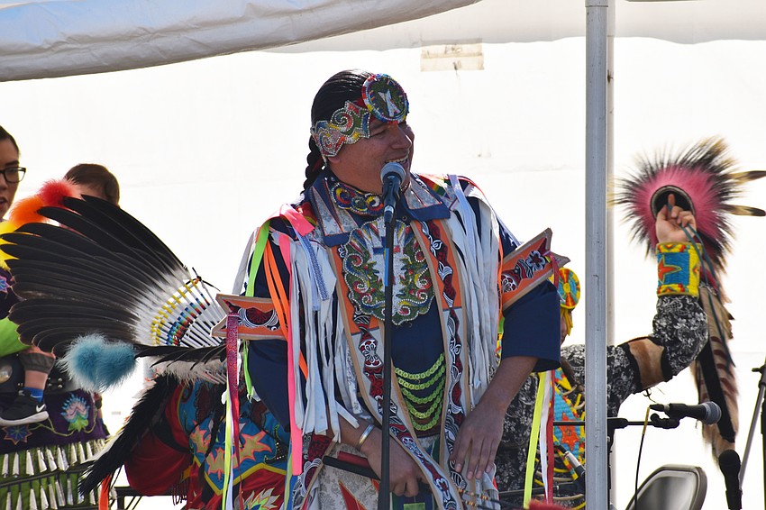 Otter Oliver teaches the crowd of onlookers about the outfits and the origins of each dance performed.