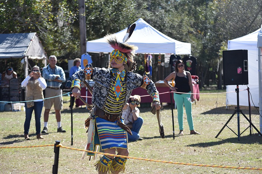 Kerry Reed performs the Native American prairie chicken dance in full costume.