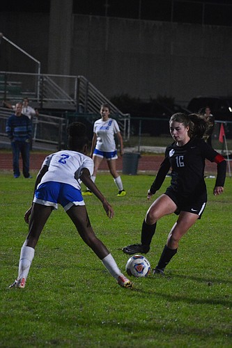 Lakewood Ranch High girls soccer senior defender Rheana White dribbles upfield against Sebring High.