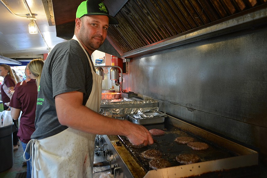 Duette's Doug Cone is on the Manatee County Cattlemen's Association board and he volunteers flipping burgers at the organization's booth during the fair.