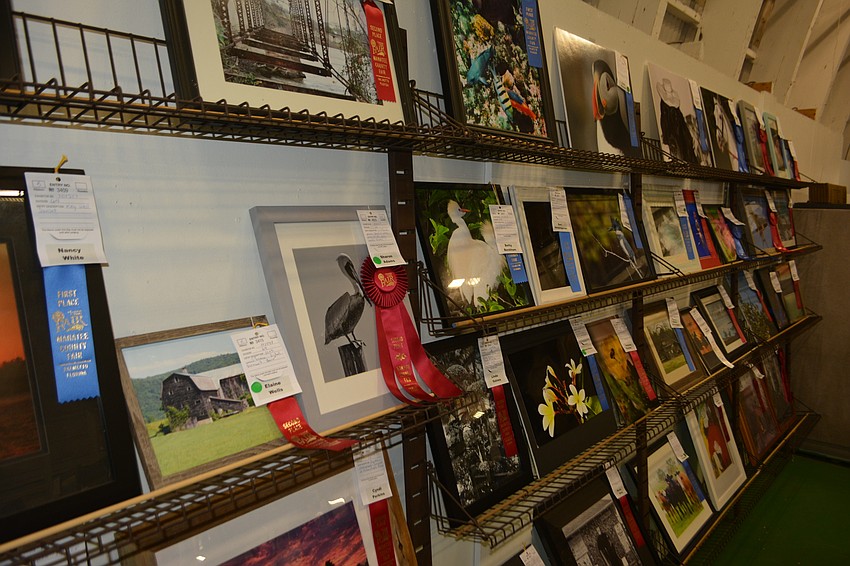 Fairgoers could sift through hundreds of photos in the craft barn.