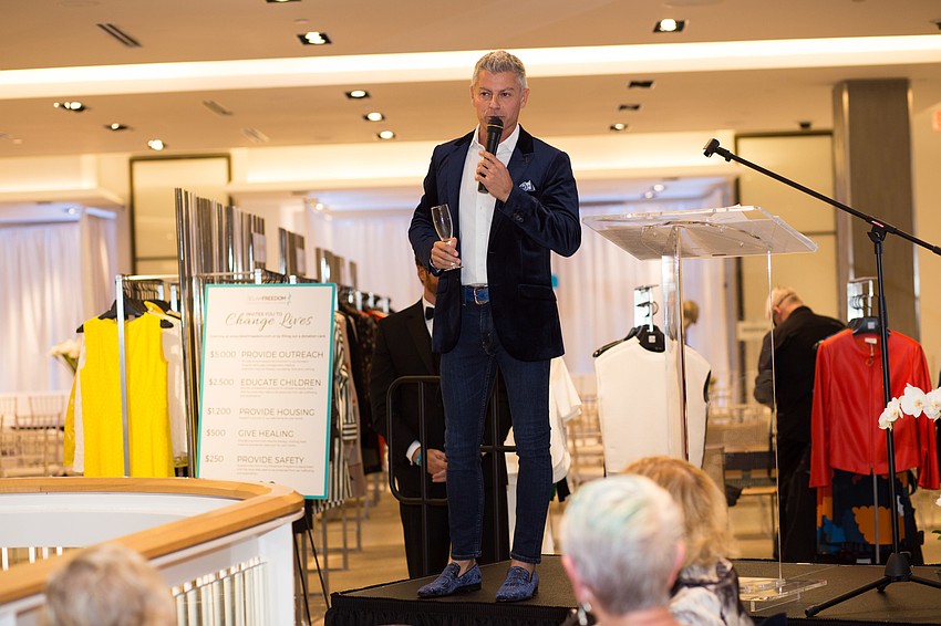 Marko Radisic auctions off the Grand Prix VIP Race experience item.