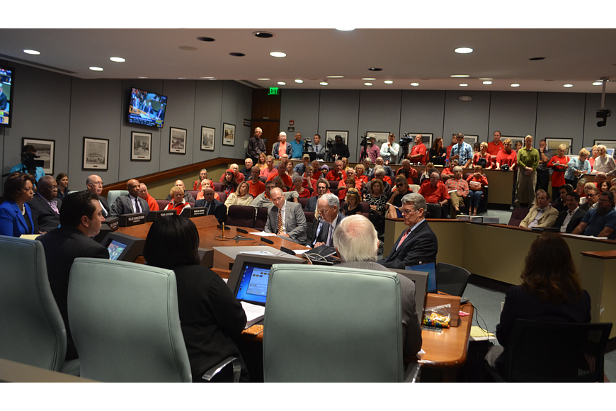 Opponents of plans to redevelop the Lido Pavilion wore red to the City Commission meeting on Jan. 14.