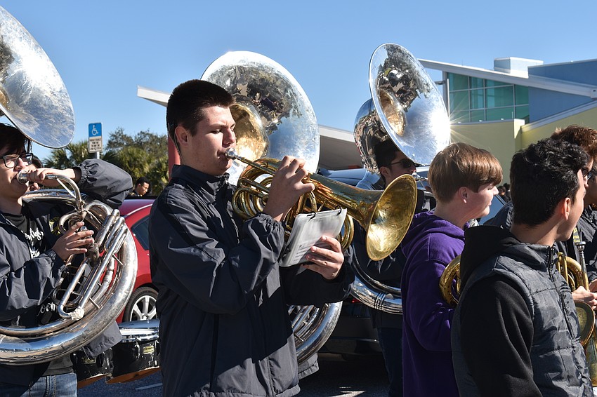Alex Fic, a French horn player in the Booker High School band, marched in the walk.