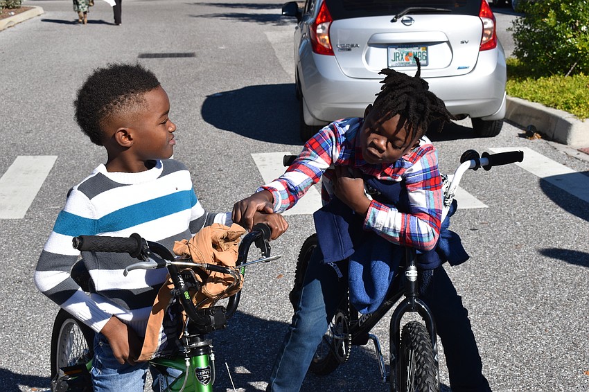 Gerard Ash and Kewain Dye rode their bikes in lieu of marching.