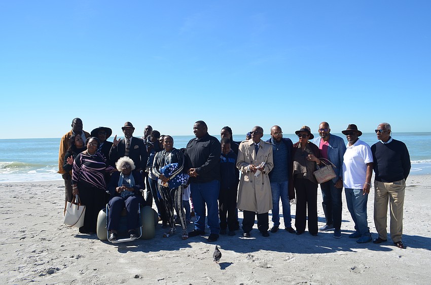 Members of the original Newtown caravans posed alongside their families at Lido Beach during today's event.