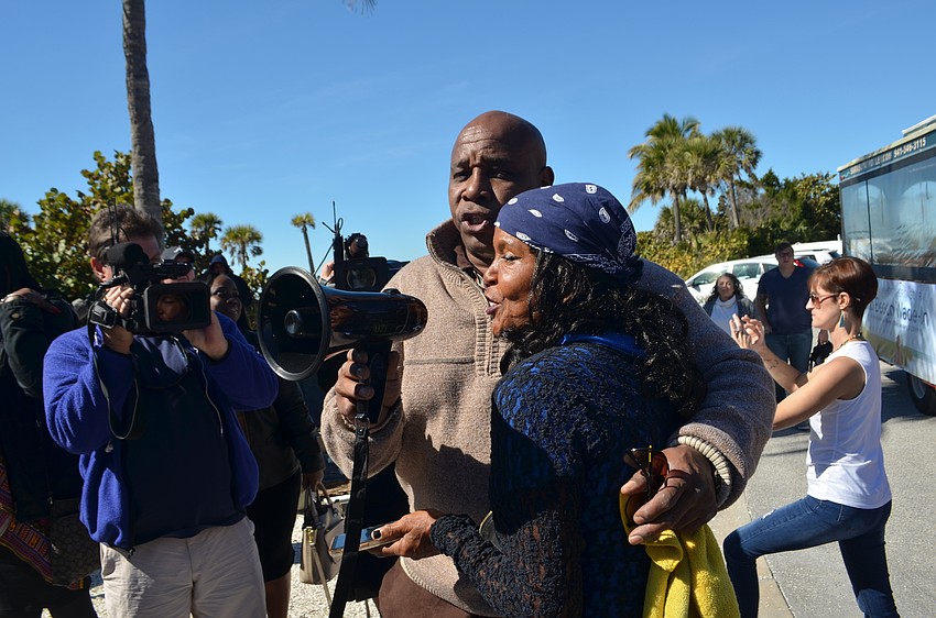 Troy Nichols and Brenda Watty led a rendition of We Shall Overcome as attendees gathered around the beach integration historical marker.