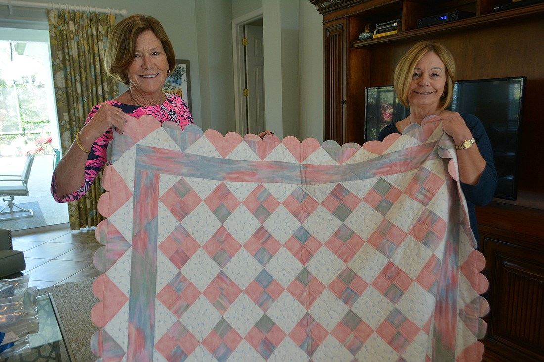 Linda Stone and Diane Laybourn have led a group that has donated more than 150 blankets to charity.
