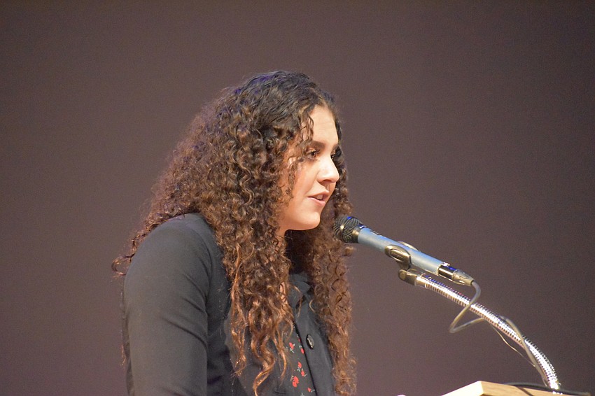 Christina Cianciola, a Riverview High School senior and winner of the essay contest, reads her essay out loud.