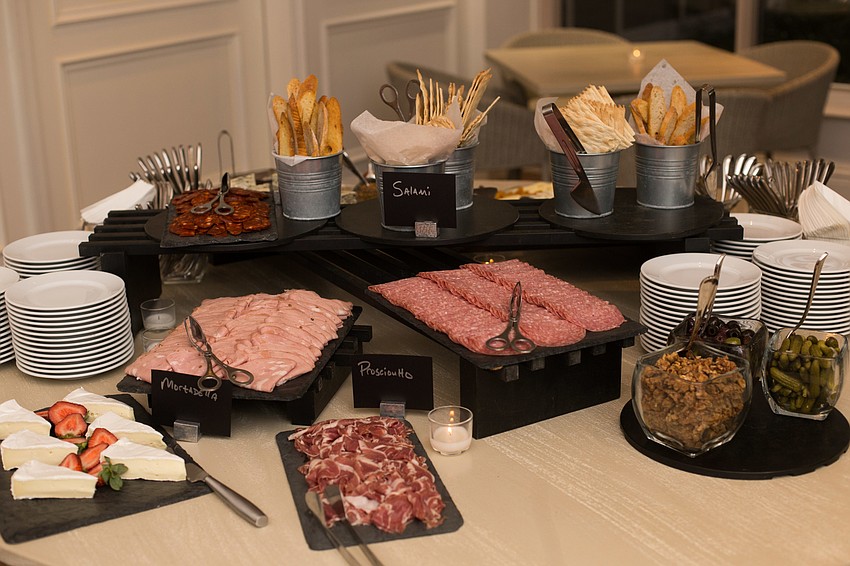 A meat and cheese table was set up for guests.