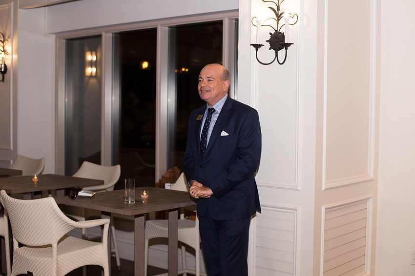 Executive Director Richard Russell thanks the patrons before handing out gifts to committee members.