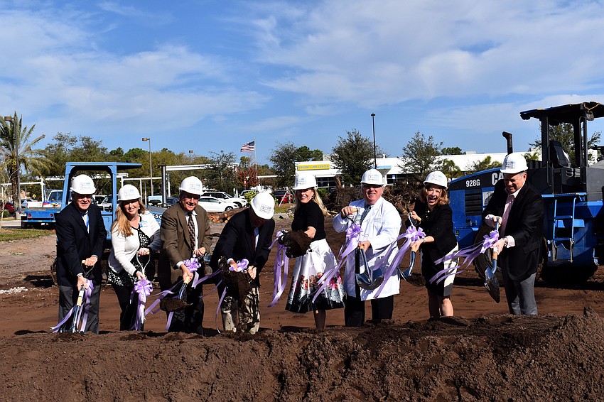 Jim Meister, Kelly Batista, James Fiorica, Bill Chapman, Susan Malloy Jones, Richard Brown, Lorrie Liang and David Verinder break ground on the Sarasota Memorial Radiation Oncology Center.