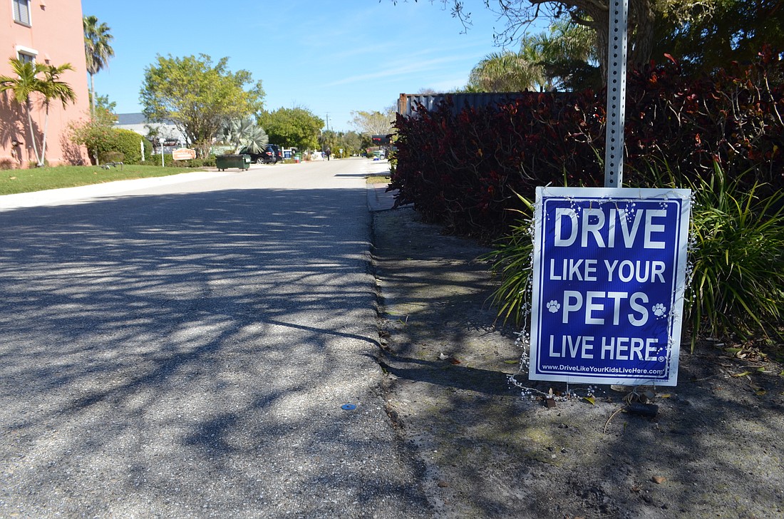 Audrey Jensen has placed a sign on Garfield Drive encouraging motorists to slow down. Jensen&#39;s advocacy started after her dog was struck by a vehicle outside her home.