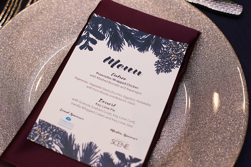 The silver plates sparkled under the hotel lights.