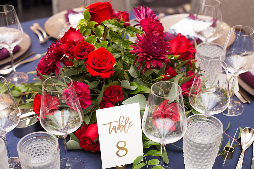 Flower bouquets centered each table.