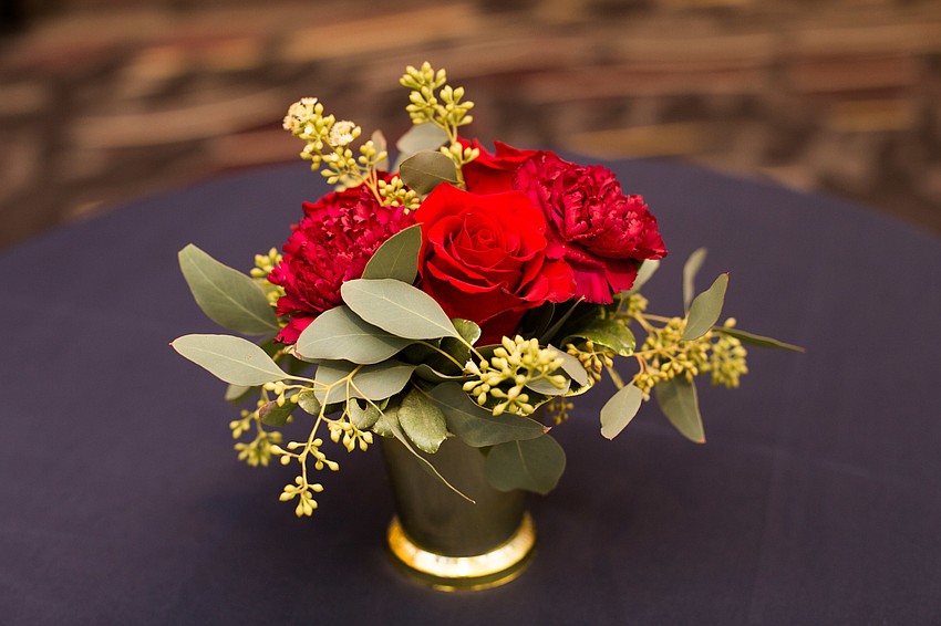 Cocktail tables were decorated with a smaller version of the table bouquets.