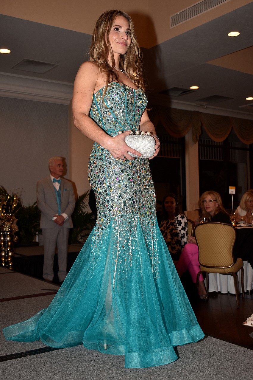 Tracy Fanara models a beaded gown from Michael’s on the Boulevard.