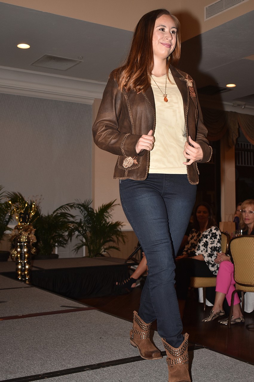 Juliana Carrillo models a jacket and boots from Michael’s on the Boulevard.