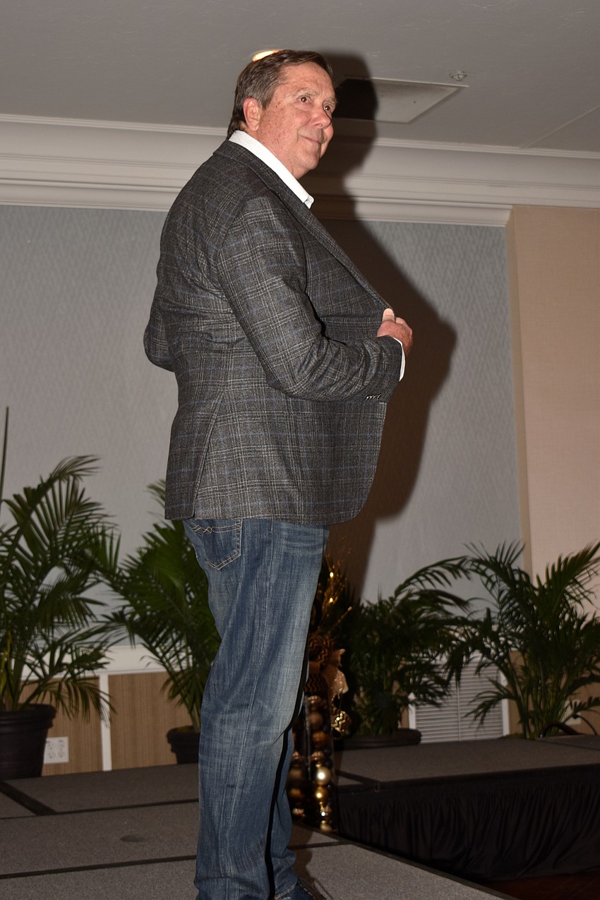 Ed Chiles smiles for the crowd as he makes his runway debut.