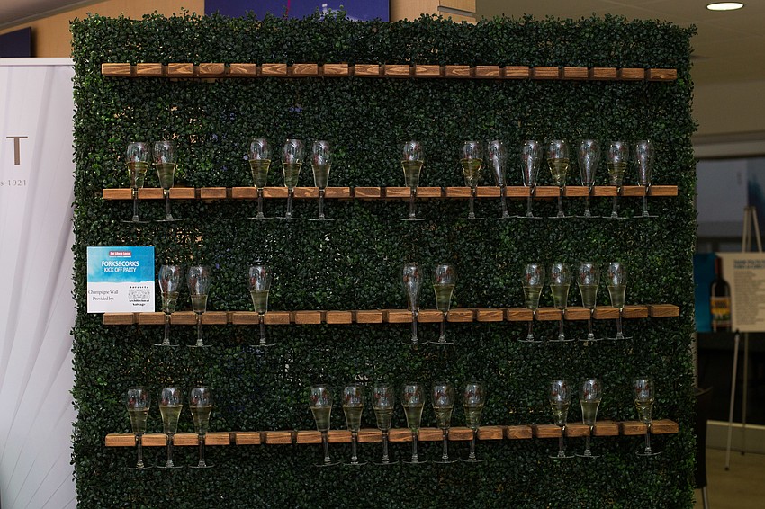 A champagne wall greeted guests upon their arrival.