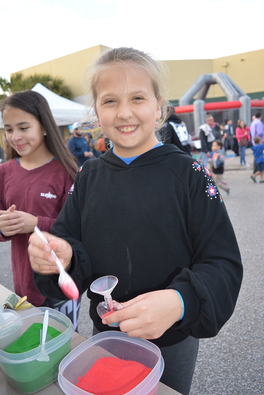 Lakewood Ranch 11-year-old Brynn Midura creates sand art.
