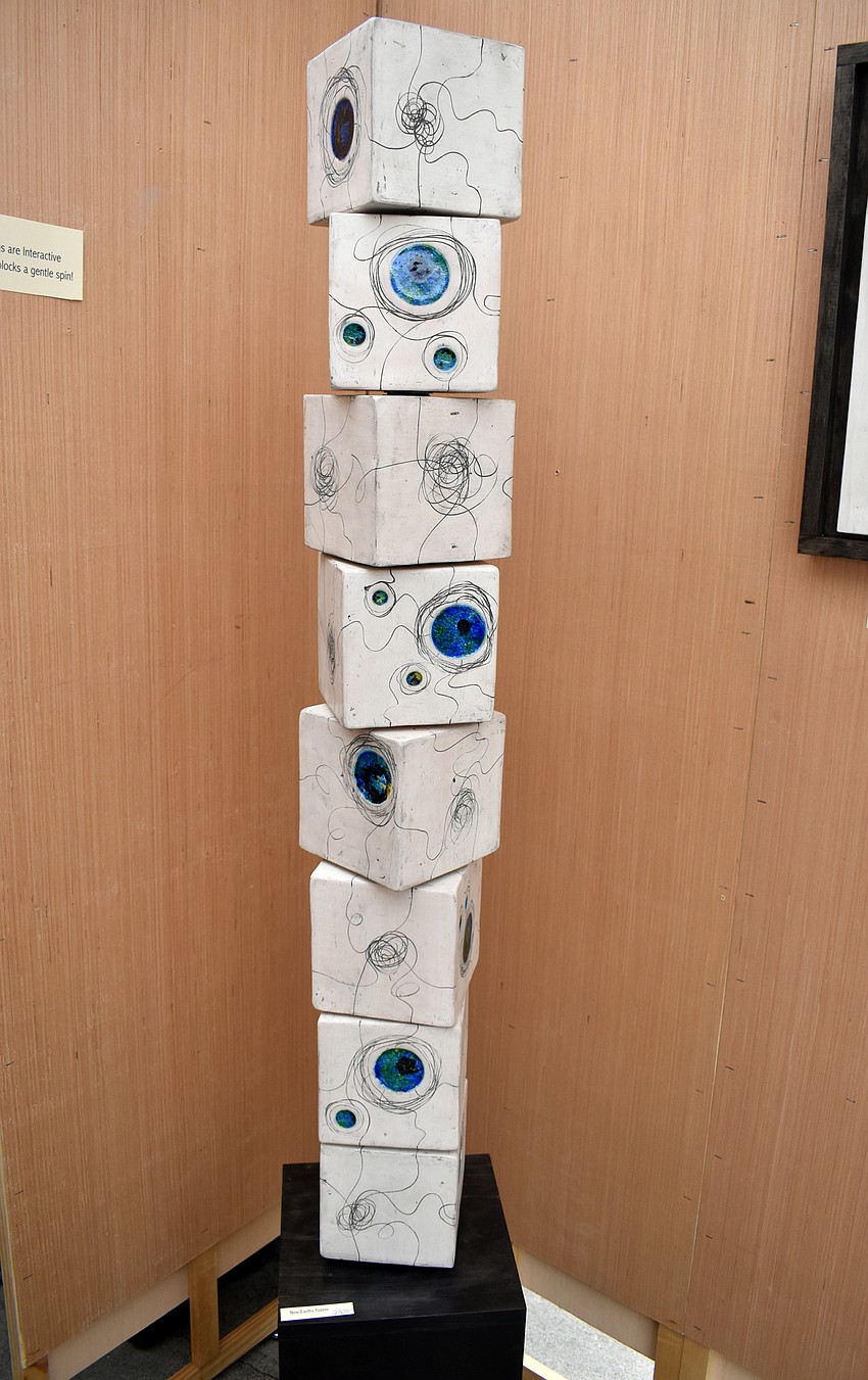 Jeff Pender’s ceramic art was interactive. People could slight spin the cubes.