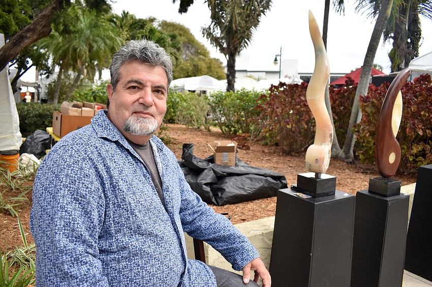Scot Buccina poses with his stone designs.
