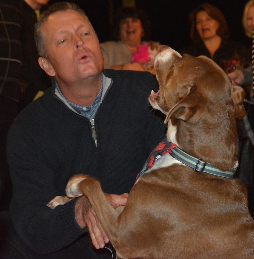 Jeff Boudrie sings a song with his rescue dog, Lola.