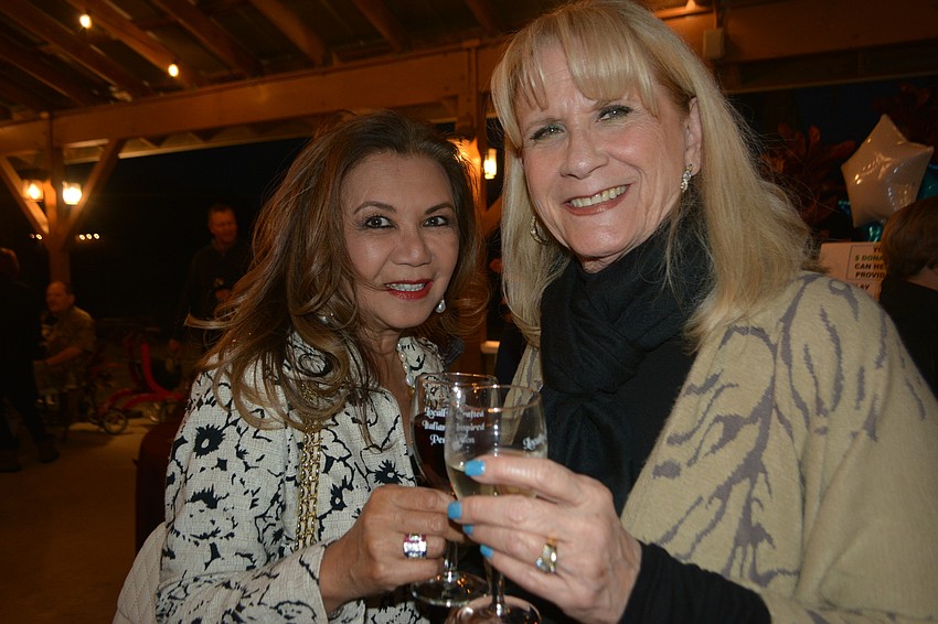 Evella Feldhacker and Deana Miklos enjoy a glass of Fiorelli wine.