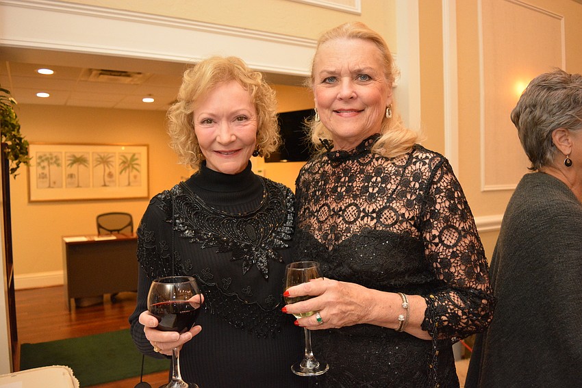 University Place's Claudia Pennington and Mote Ranch's Glo Reber enjoyed going through the silent auction items.