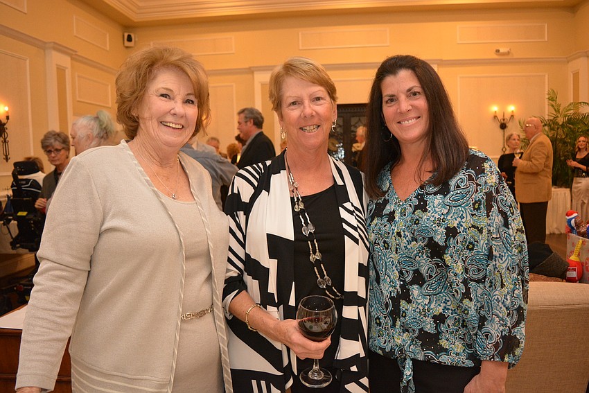 East County's Jan Sharpe visits with Palm Aire's Becky Romich and Marci Weibel. Sharpe and Weibel registered guests.