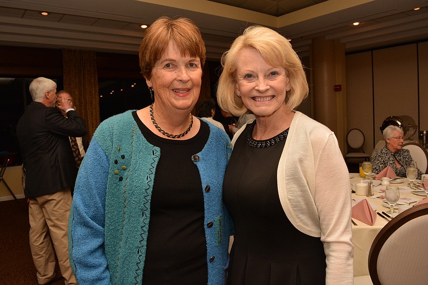 Palm Aire's Barb Saabye and Maureen Decker love seeing the puppies. Decker said she was tempted to take them home.