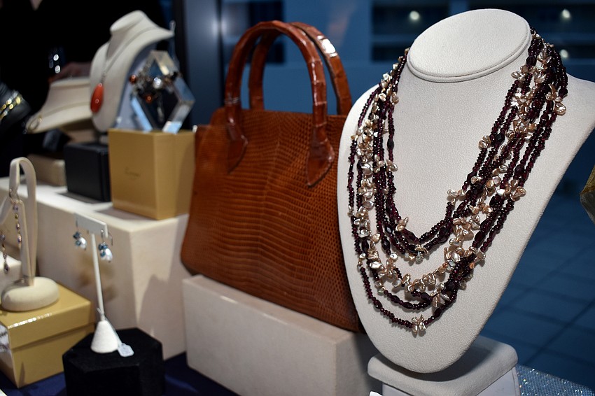 During cocktail hour, guests bid on jewelry as part of the silent auction.