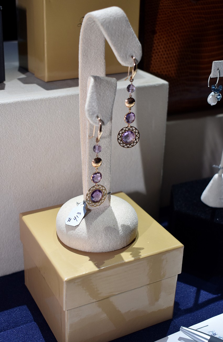 During cocktail hour, guests bid on jewelry as part of the silent auction.