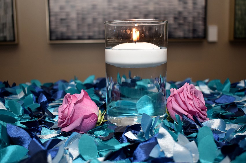 Blues flower petals decorate high-top tables during cocktail hour.
