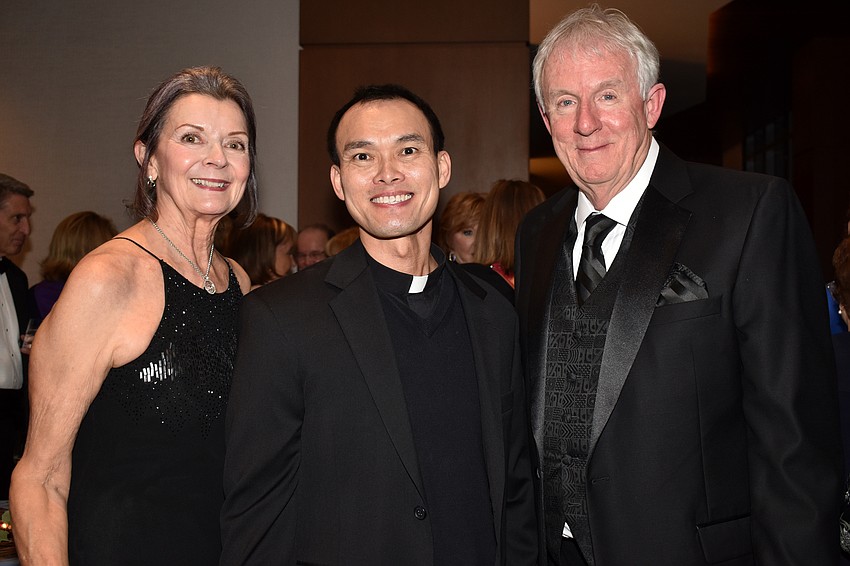 Kate Shaver, the Rev. John Hoang and Dave Shaver