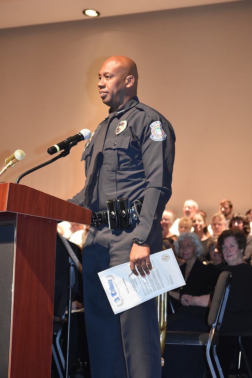 Deputy Dominic Harris, an SRO at Booker High School, accepts his award.