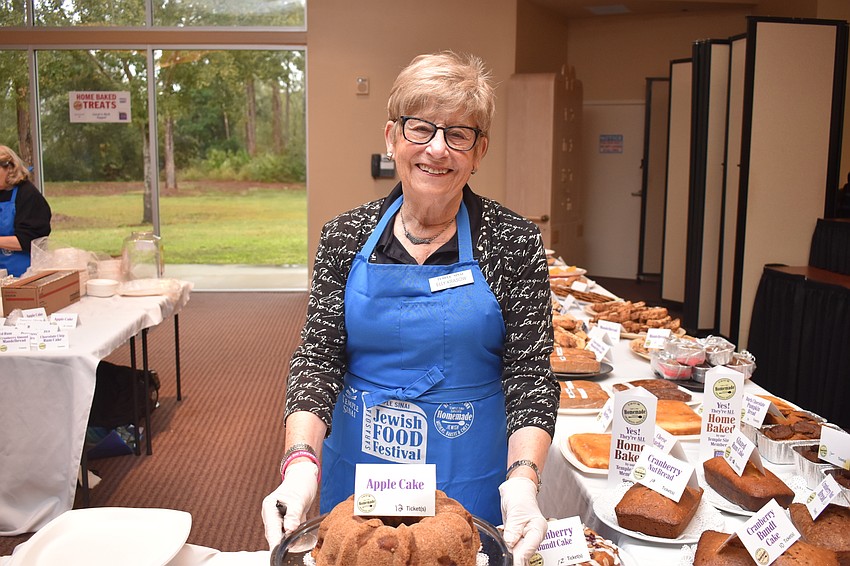 Elly Krasow helps serve the baked goods.