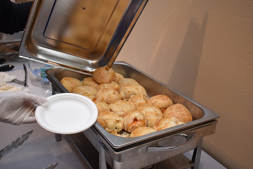 A puff pastry filled with sweet potatoes is called a quiche of sorts by those who are serving it.