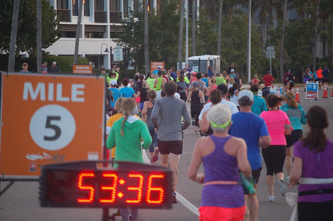 Athletes make their way off the Ringling Bridge nearly an hour into the 2018 running of the Sarasota Music Half-Marathon and Rockin&#39; 10K.