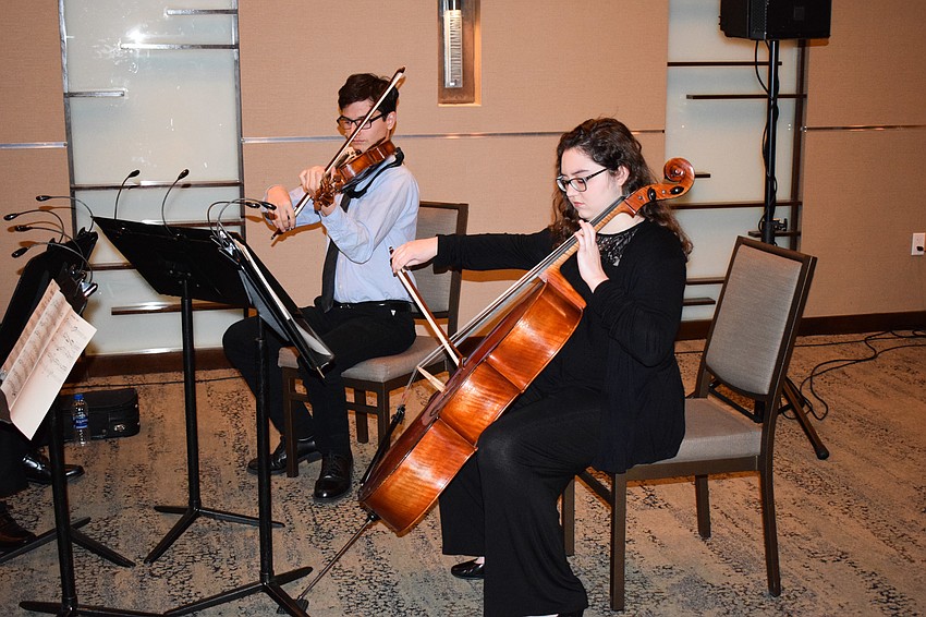 The Sarasota Youth Orchestra String Ensemble played for guests.