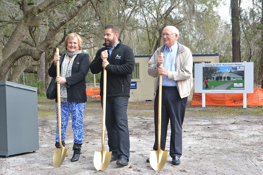 From left to right: Haven chairwoman May Ahdab, Haven president and CEO Brad Jones, and Bernie Hardiek of the Hardiek Foundation pose for a picture at the groundbreaking for Mary Jane&#39;s House on Thursday, Jan. 31.