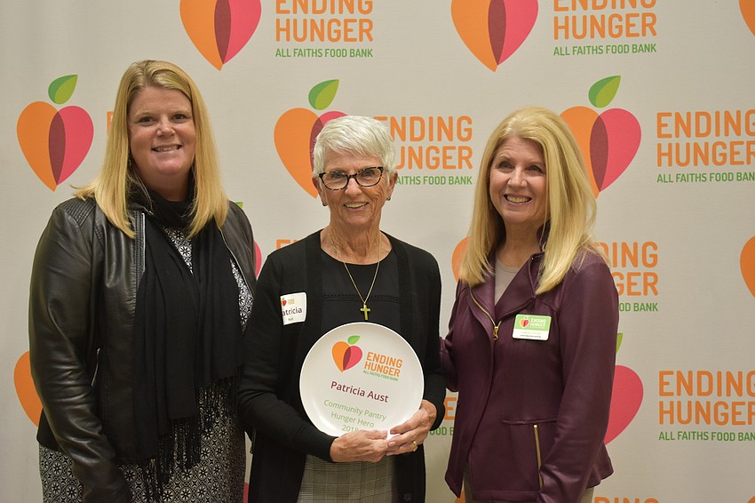 All Faith's Food Bank Colleen Reinert, award winner Patricia Aust and CEO Sandra Frank