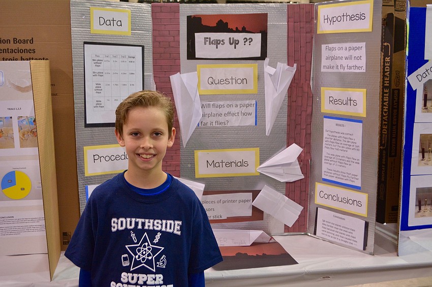 Tyler Wolfinger is a third grade student from Southside Elementary School. He stands beside his project, 