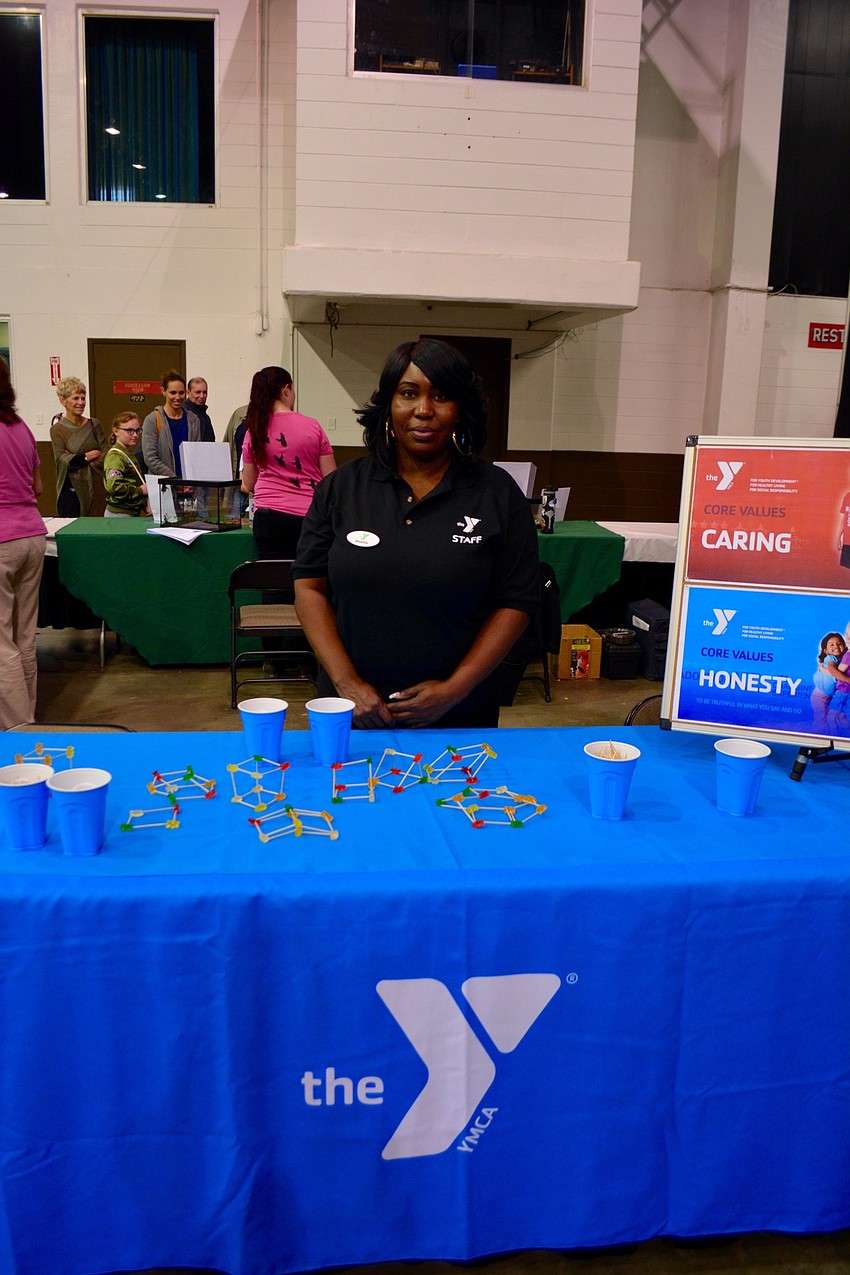 Jessica Young represented the YMCA at the STEM Fair Expo and helped kids to make three-dimensional shapes with toothpicks and gummy bears.