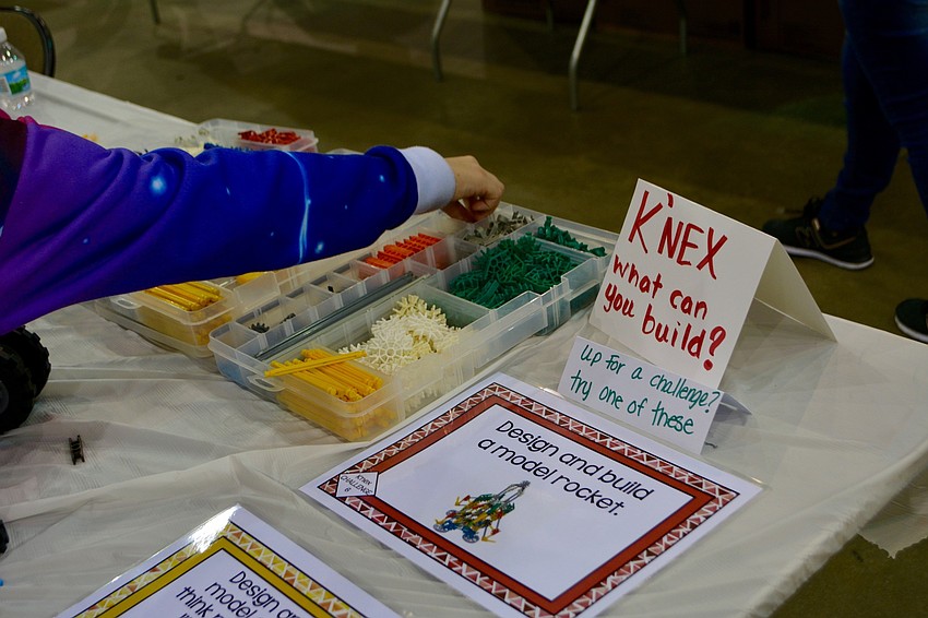 Various vendors and science-related merchants brought toys and experiments for the students and their families to play with.